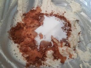 Add cocoa, milk, and sugar to remaining batter.