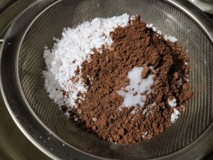 Sift Icing Sugar And Cocoa Powder Over The Creamed Mixture Sift Icing Sugar And Cocoa Powder Over The Creamed Mixture