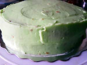 Fully frosting Pista cake.