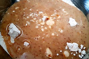 Pour wet mix into dry mix. Pour wet mix into dry mix.