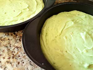 Pour cake batter in pans.