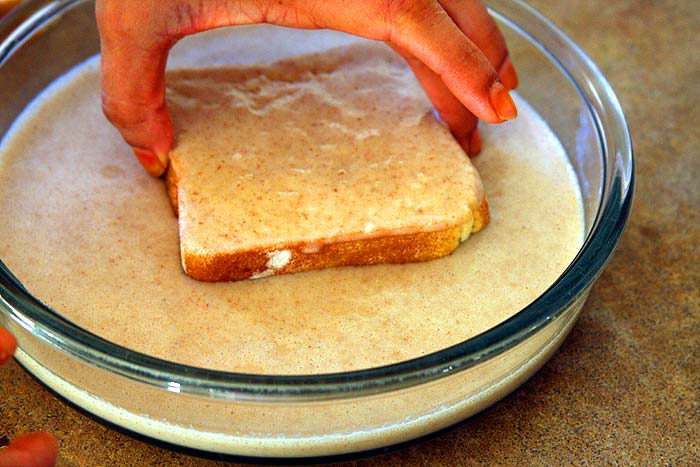 Dip bread into the mix gently on first side.