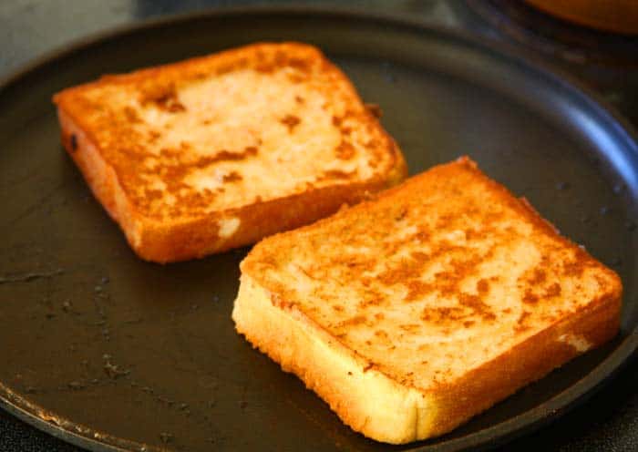 Toast the dipped bread on both sides until golden brown.