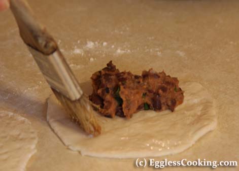 Vegetarian Empanadas:Glue edges with milk.