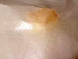 Place the parchment paper on cookie dough ball Place the parchment paper on cookie dough ball