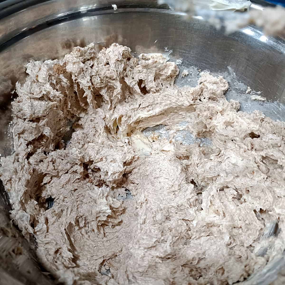 Cream butter and sugar: Vegan butter and brown sugar are beaten together until smooth, light, and fluffy.