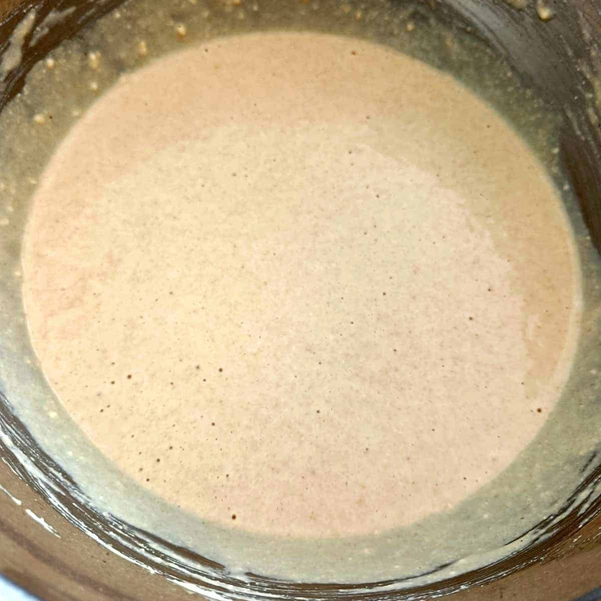 Smooth eggless waffle batter mixed to a pourable pancake batter consistency