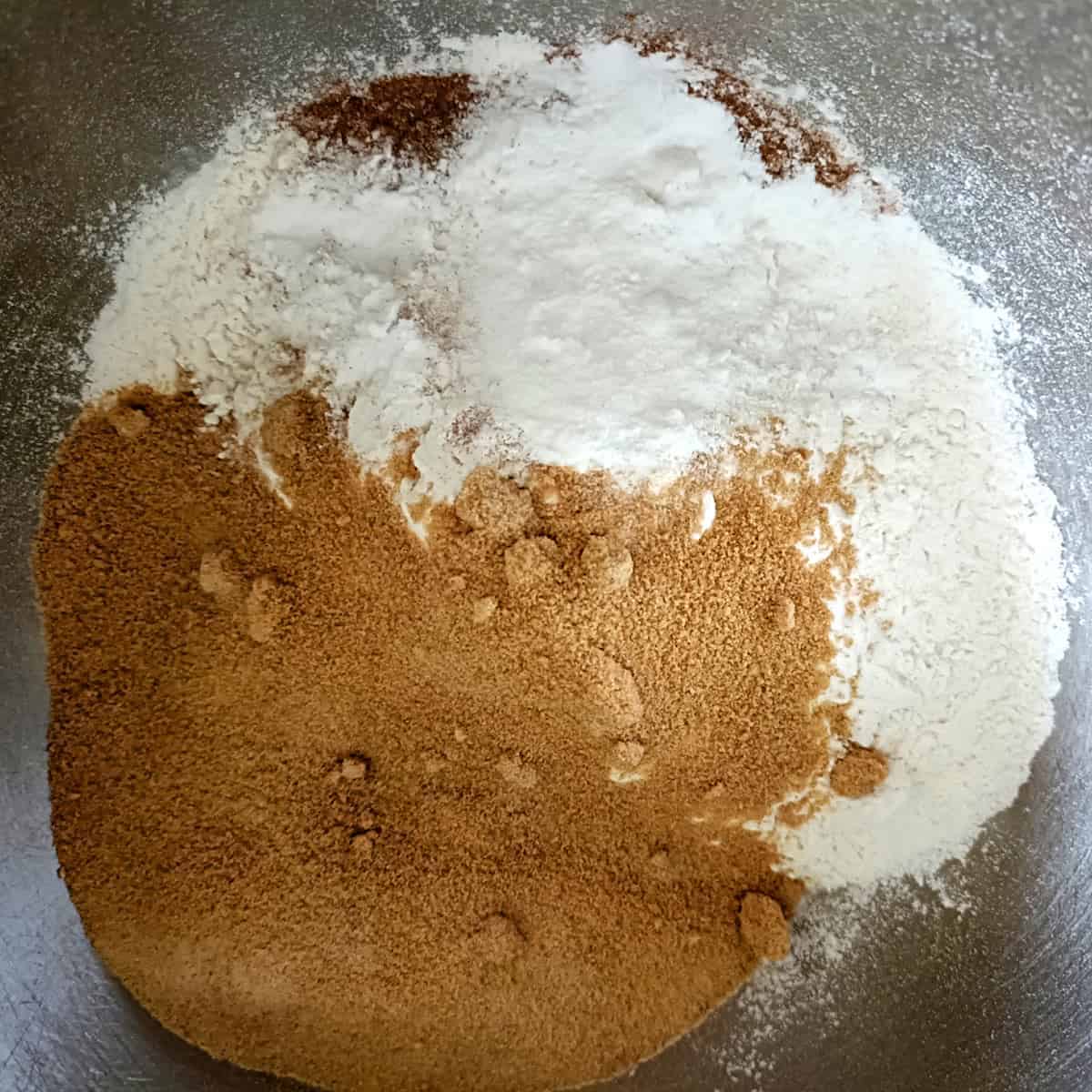 Flour, sugar, and leavening mixed for strawberry banana muffins
