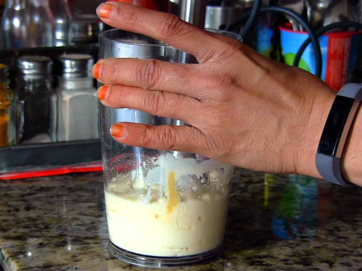 Blending ingredients to emulsify eggless mayonnaise using a hand blender