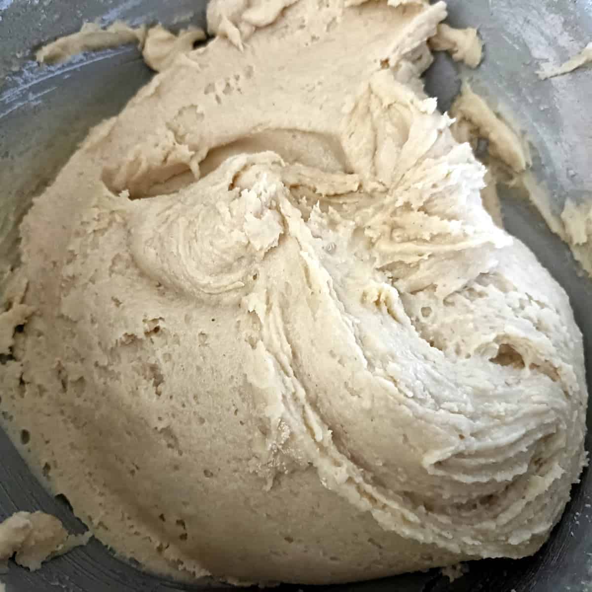 The dry and wet ingredients are mixed together to form a soft, cohesive cookie dough.