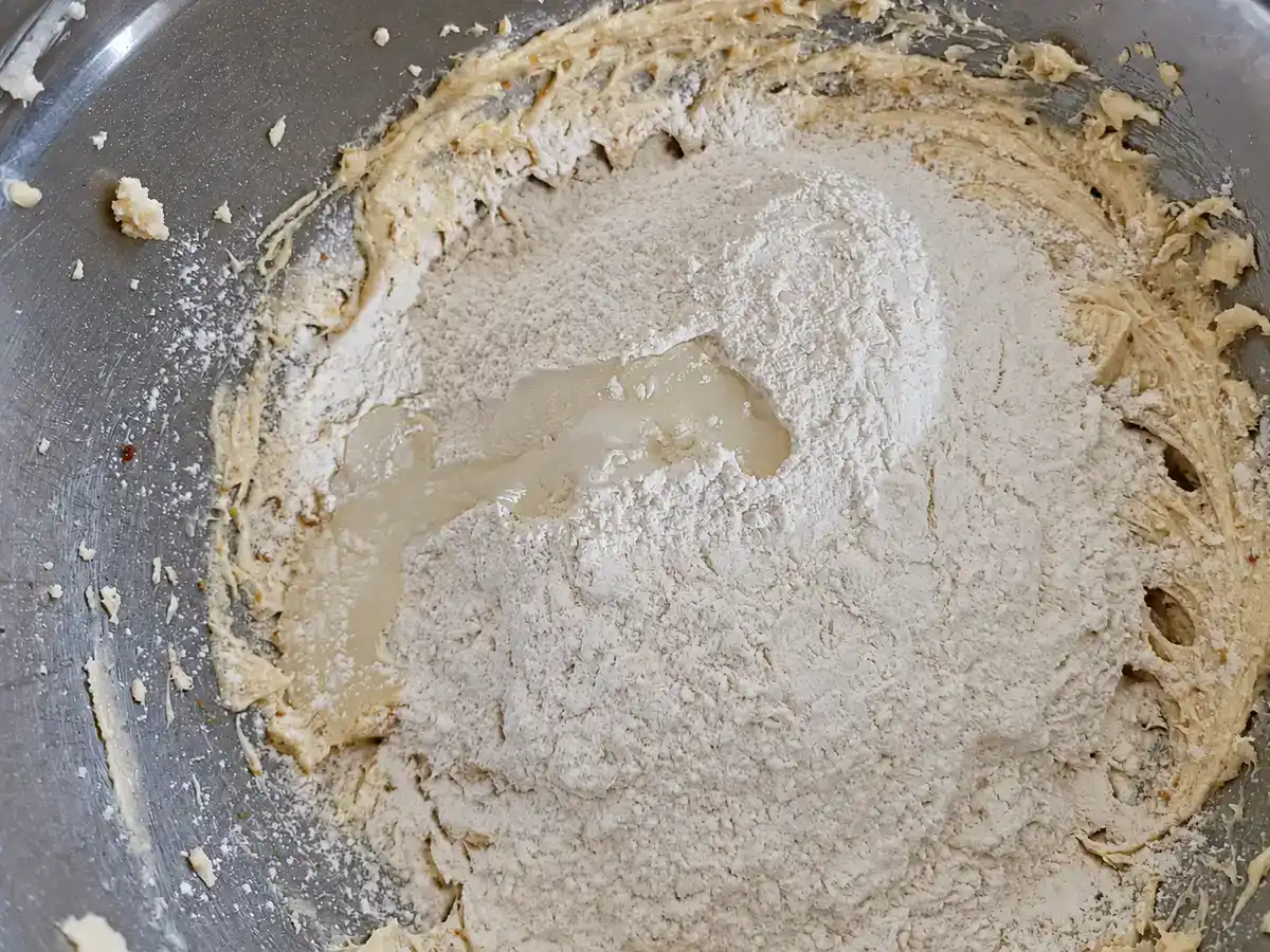 Flour, baking soda, and salt added to the wet mixture for cookie dough