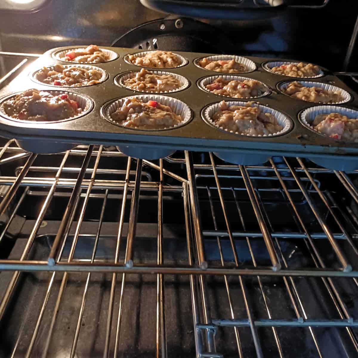 Strawberry banana muffins baking in oven
