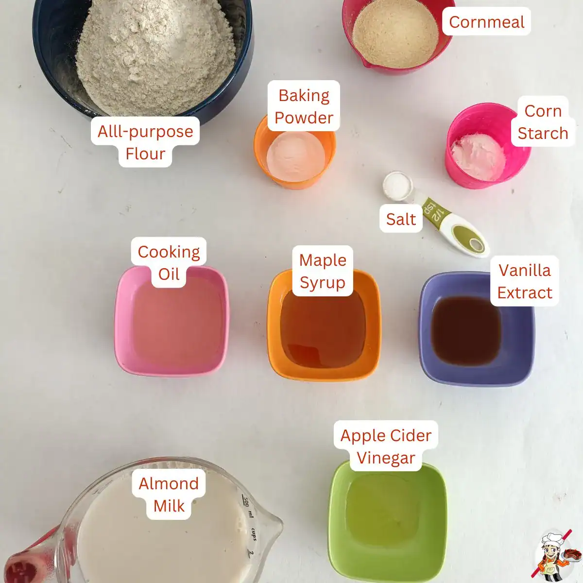 Eggless waffle ingredients with flour, almond milk, cornmeal, baking powder, cornstarch, oil, maple syrup, vanilla, salt, and apple cider vinegar